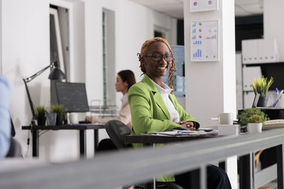 Portrait of young man working at office