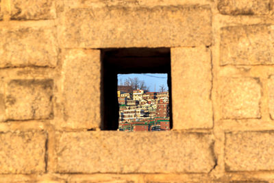 View of buildings seen through window