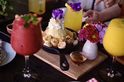 Midsection of people on table in restaurant