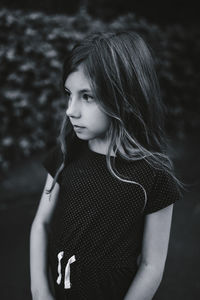 Portrait of a beautiful young woman standing outdoors