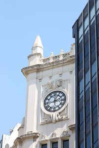 Low angle view of clock tower against sky