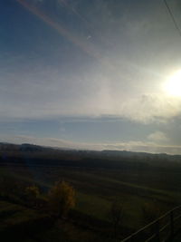 Scenic view of field against sky during sunset