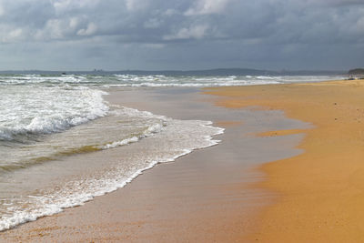 Scenic view of beach against sky