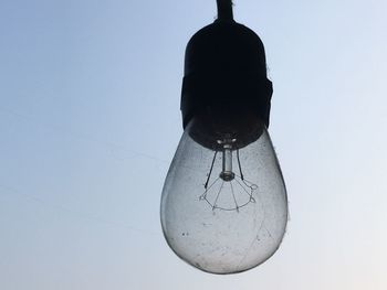 Low angle view of hanging against clear sky