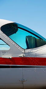 Low angle view of airplane against clear sky