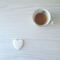 Directly above shot of coffee cup on table