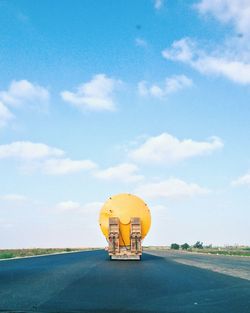 Vehicle on road against sky