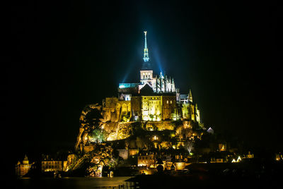 Illuminated buildings in city at night