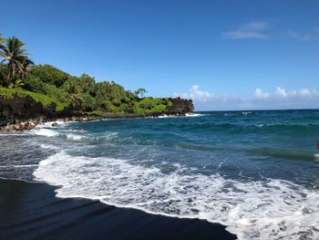 Scenic view of sea against blue sky