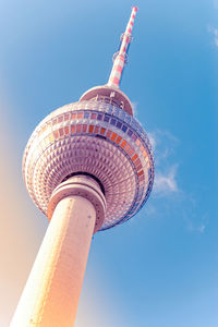 Low angle view of tower against blue sky