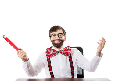 Portrait of smiling young man against white background
