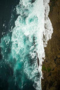 Waves splashing on rocks