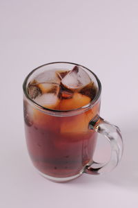 Close-up of ice tea against white background