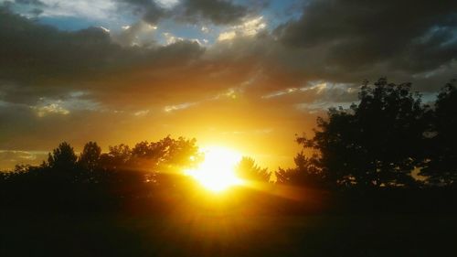 Scenic view of dramatic sky at sunset