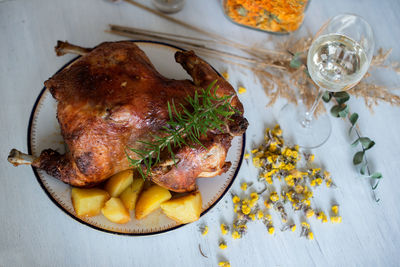 Close-up of chicken in plate on table