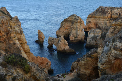 High angle view of rocks at sea shore