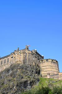 Low angle view of fort against blue sky