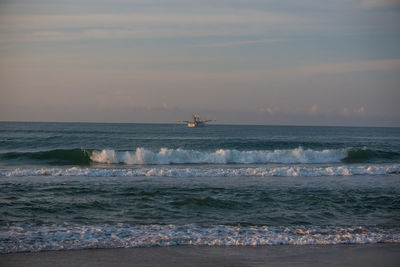 Scenic view of sea against sky during sunset