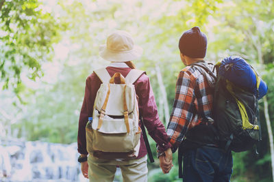 Rear view of couple walking outdoors