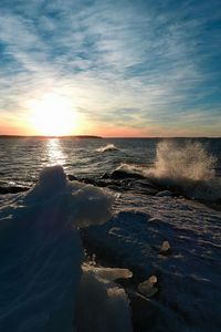 Scenic view of sea against dramatic sky