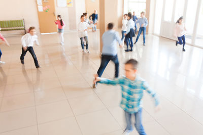 Kids running in school corridor