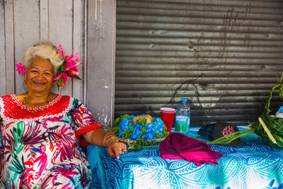 Portrait of woman holding multi colored umbrella