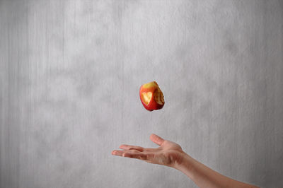 Close-up of hand holding fruit