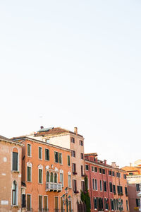 Low angle view of buildings against clear sky