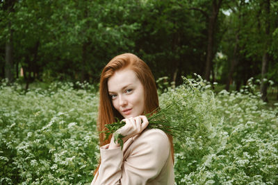 Healing power of nature, benefits of ecotherapy, nature impact wellbeing. happy redhead woman