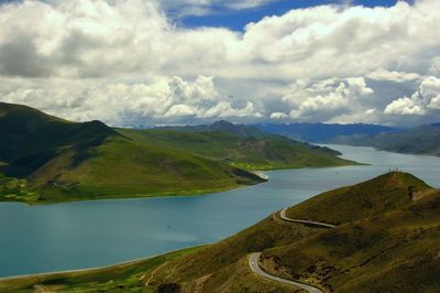 Scenic view of lake and mountains against sky