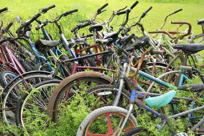 Bicycles parked on grassy field