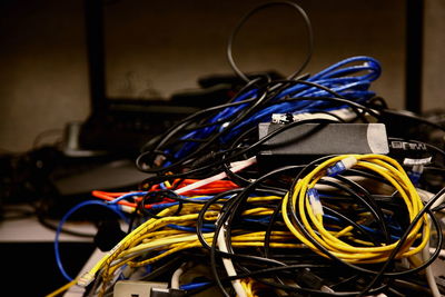 Close-up of tangled cables in server room