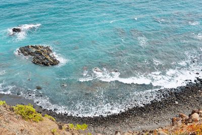 High angle view of rocks on beach