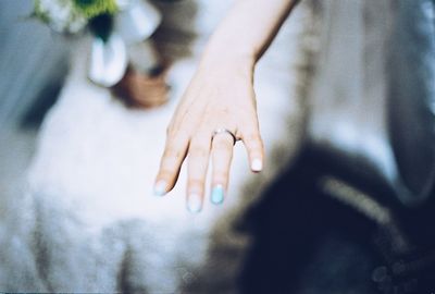 Close-up of bride showing wedding ring