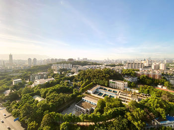 High angle view of buildings in city against sky