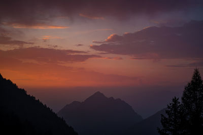 Scenic view of silhouette mountains against sky during sunset