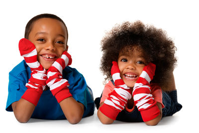 Portrait of smiling boy against white background