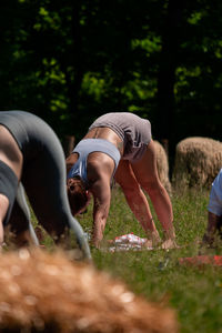 Low section of woman exercising in park