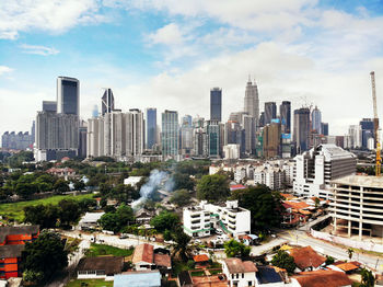 Modern buildings in city against sky