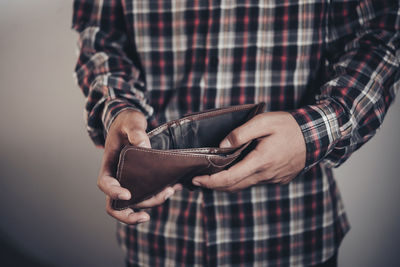 Close-up of man holding camera