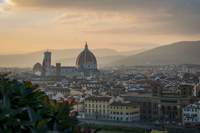 Duomo santa maria del fiore in city against sky during sunset