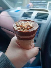 Midsection of person holding ice cream