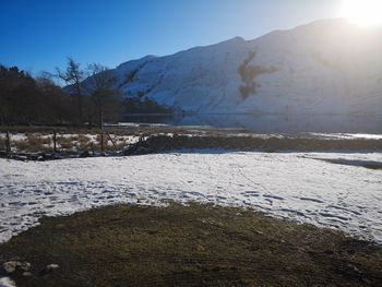 Scenic view of snowcapped mountains against sky