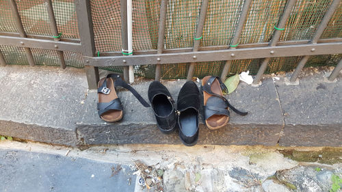 Low section of man standing on footpath