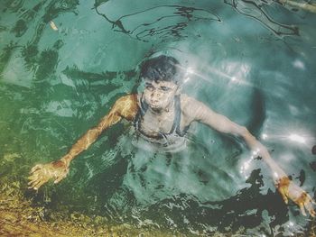 Young woman swimming in pool