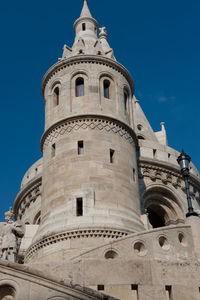 Low angle view of building against blue sky