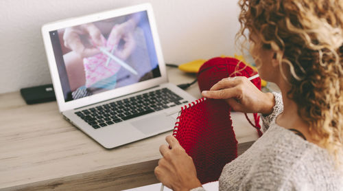 Woman using laptop on table