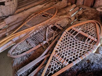 High angle view of wicker basket on wood