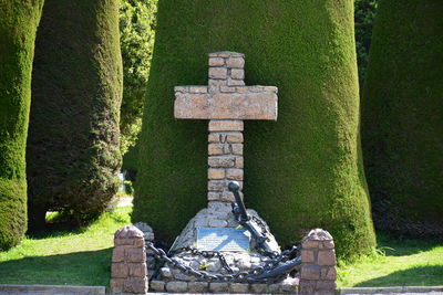 View of cross in against trees