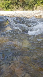 Scenic view of river flowing through rocks